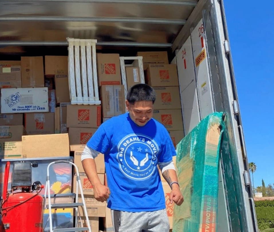 Big Deahl's crew member loading a moving truck