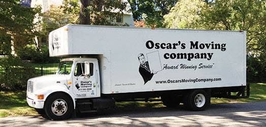 Oscar's Moving Company truck on a residential street