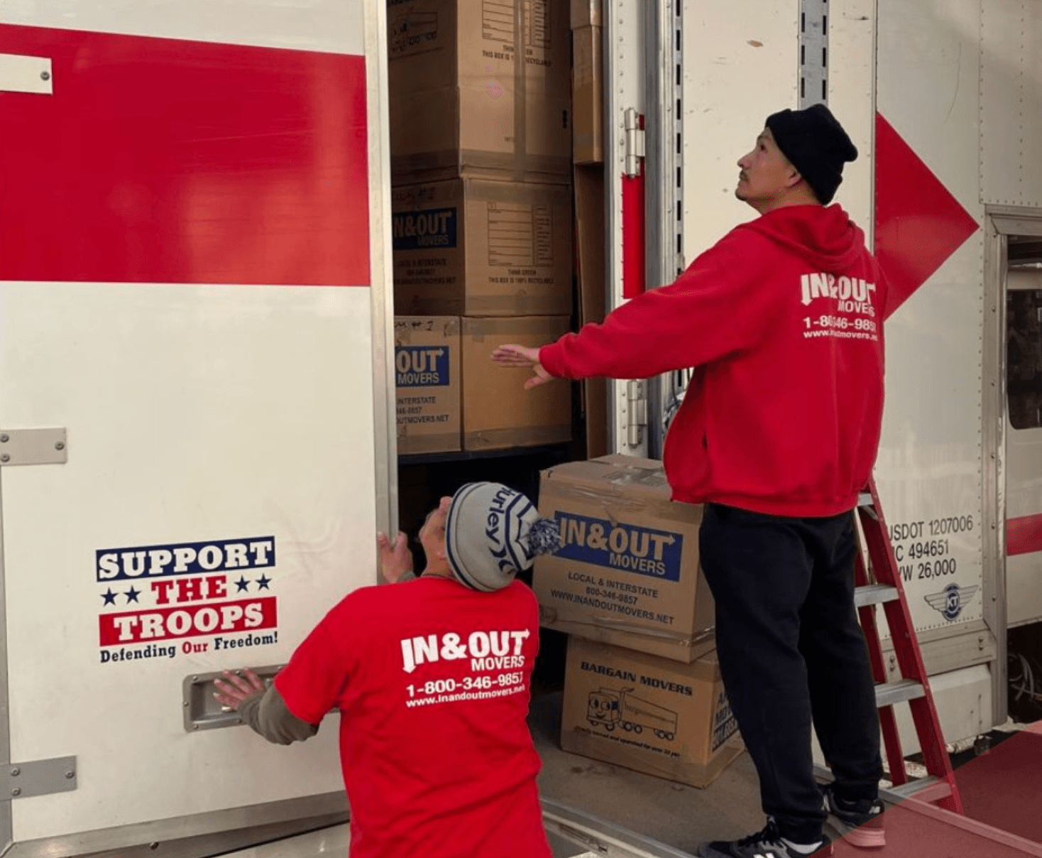 Crew loading boxes into truck